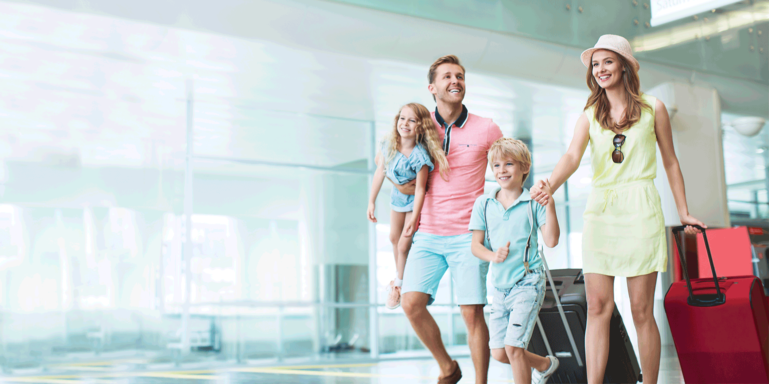 Family walking in airport terminal